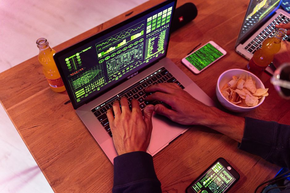 Student reviewing code notes on a laptop
